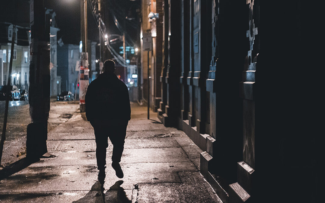 man walking at night